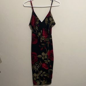 Fitted midi dress. Black with roses. Very stretchy.